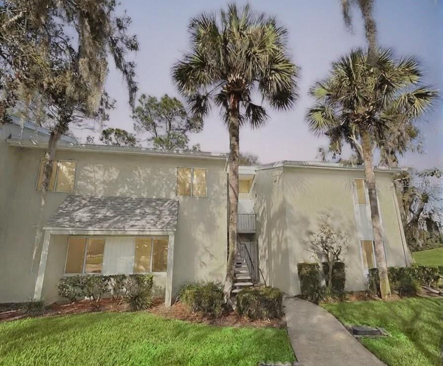 622 Fairways Circle, Unit A Ocala, FL 34472 - Photo 1 of 26 a front view of a house with garden