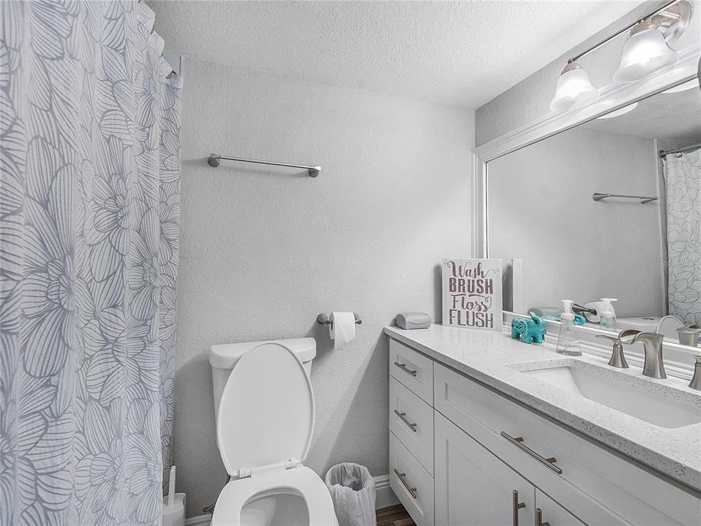 622 Fairways Circle, Unit A Ocala, FL 34472 - Photo 14 of 26 a bathroom with a toilet sink and mirror