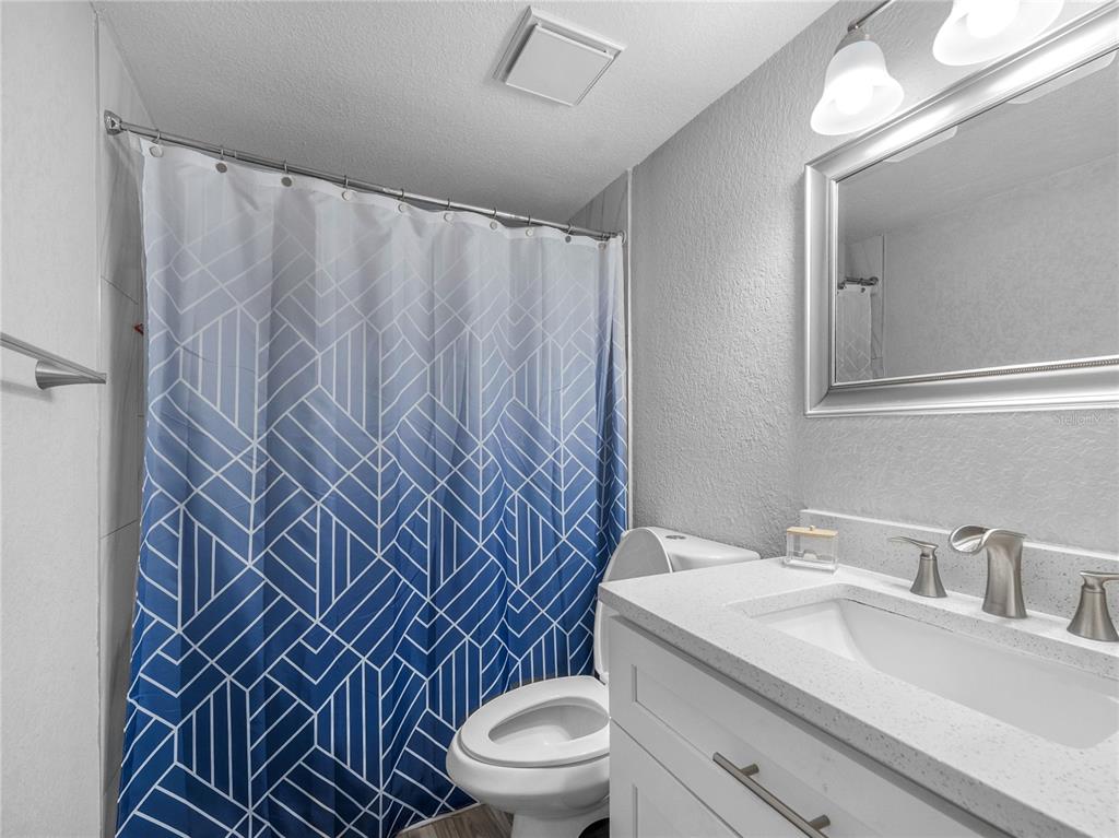 622 Fairways Circle, Unit A Ocala, FL 34472 - Photo 18 of 26 a bathroom with a sink a toilet and shower