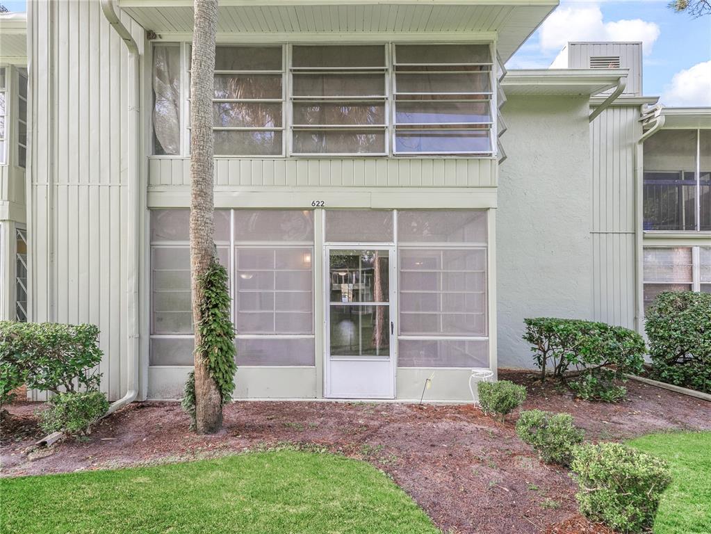 622 Fairways Circle, Unit A Ocala, FL 34472 - Photo 20 of 26 a front view of a house with a garden