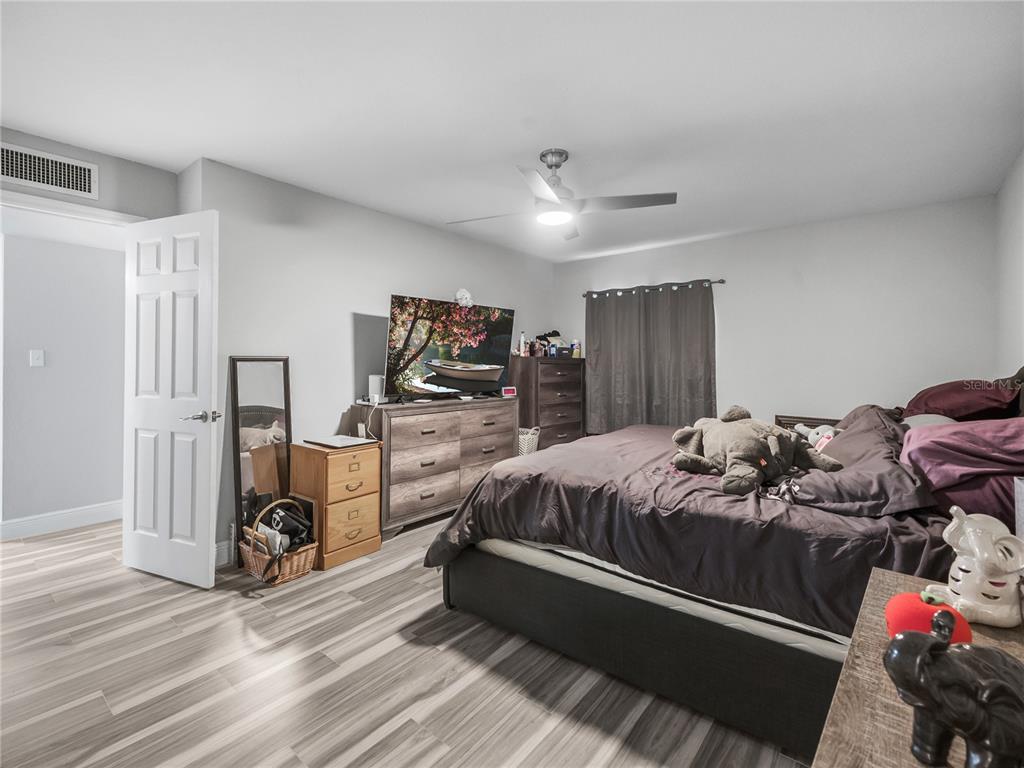 622 Fairways Circle, Unit A Ocala, FL 34472 - Photo 23 of 26 a bed room with a bed and a flat tv screen