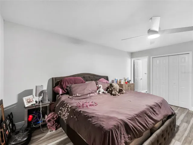 a bedroom with a bed and a closet