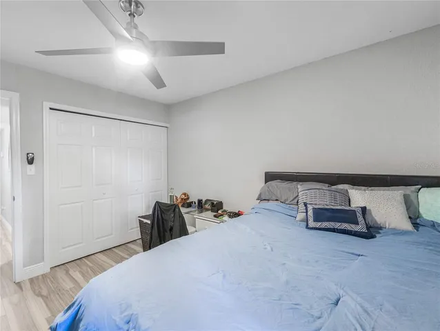 a bedroom with a bed and a cabinets