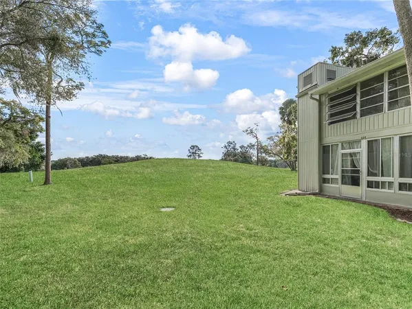 a backyard of a house with lots of green space