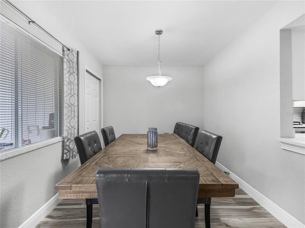 622 Fairways Circle, Unit A Ocala, FL 34472 - Photo 10 of 26 a view of a dining room with furniture and wooden floor