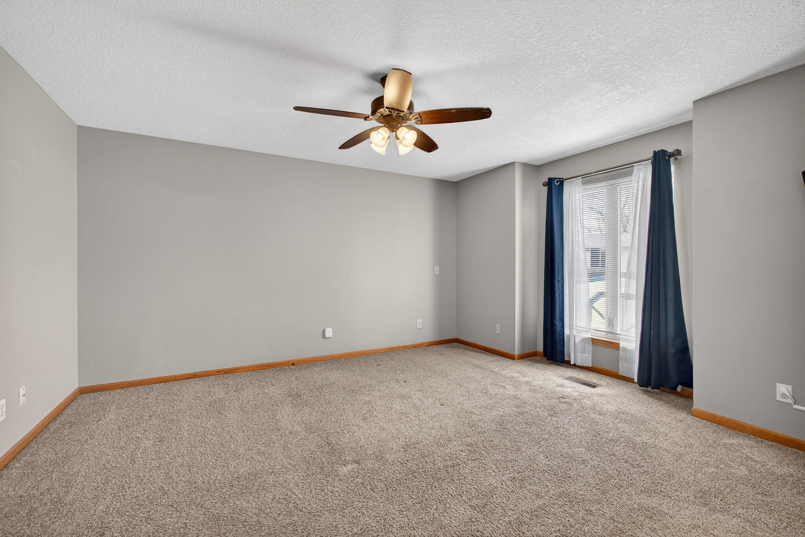 313 Sullivan Drive Colona, IL 61241 - Photo 16 of 41 an empty room with windows and fan