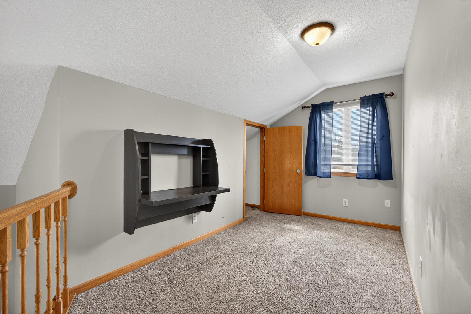 313 Sullivan Drive Colona, IL 61241 - Photo 22 of 41 a view of an empty room with a fireplace and a window