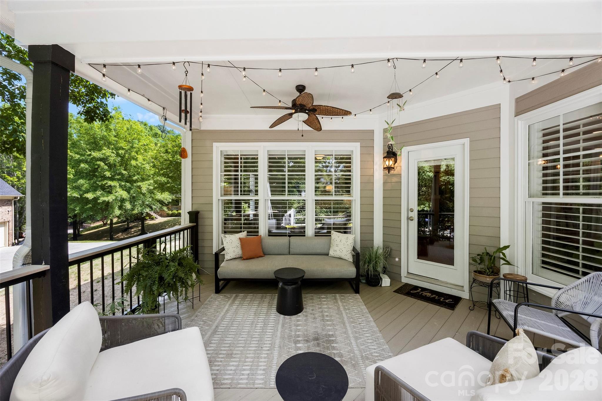 606 Andover Lane Tega Cay, SC 29708 - Photo 13 of 48 a living room with furniture windows and a chandelier