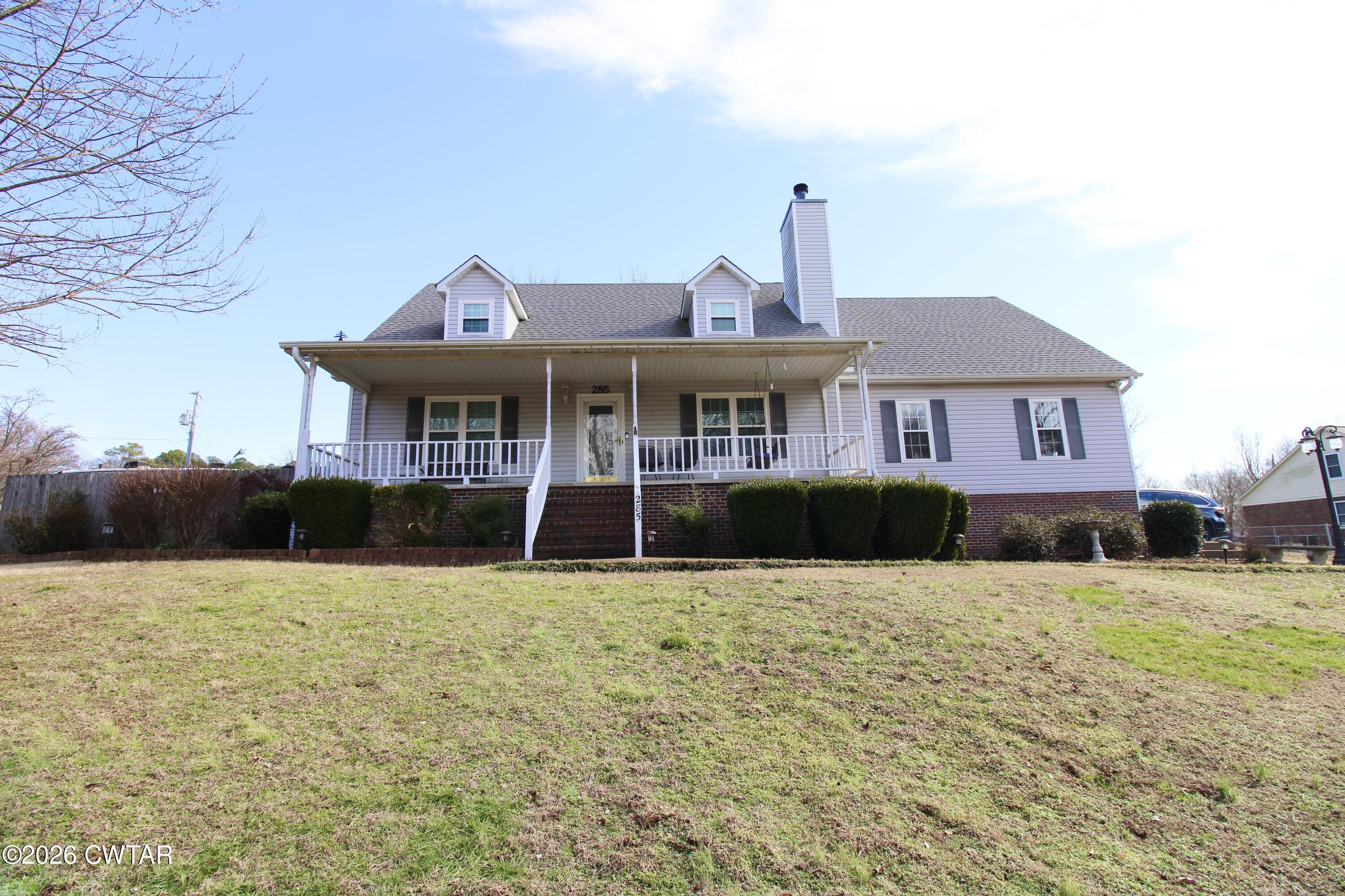 285 Meadowbrook Circle Lexington, TN 38351 - Photo 1 of 26 a front view of a house with a yard