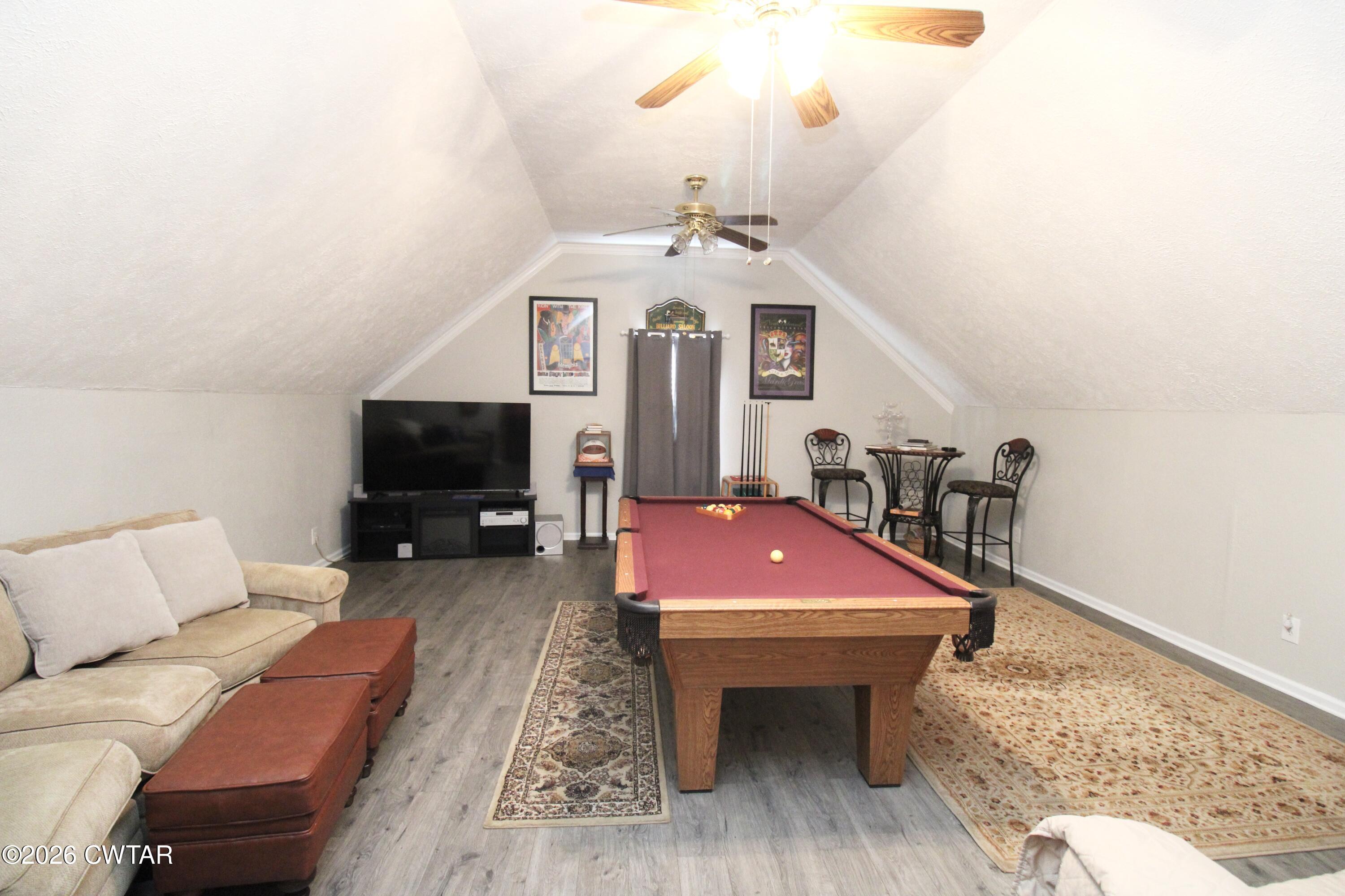 285 Meadowbrook Circle Lexington, TN 38351 - Photo 17 of 26 a spacious bedroom with a bed and a couch