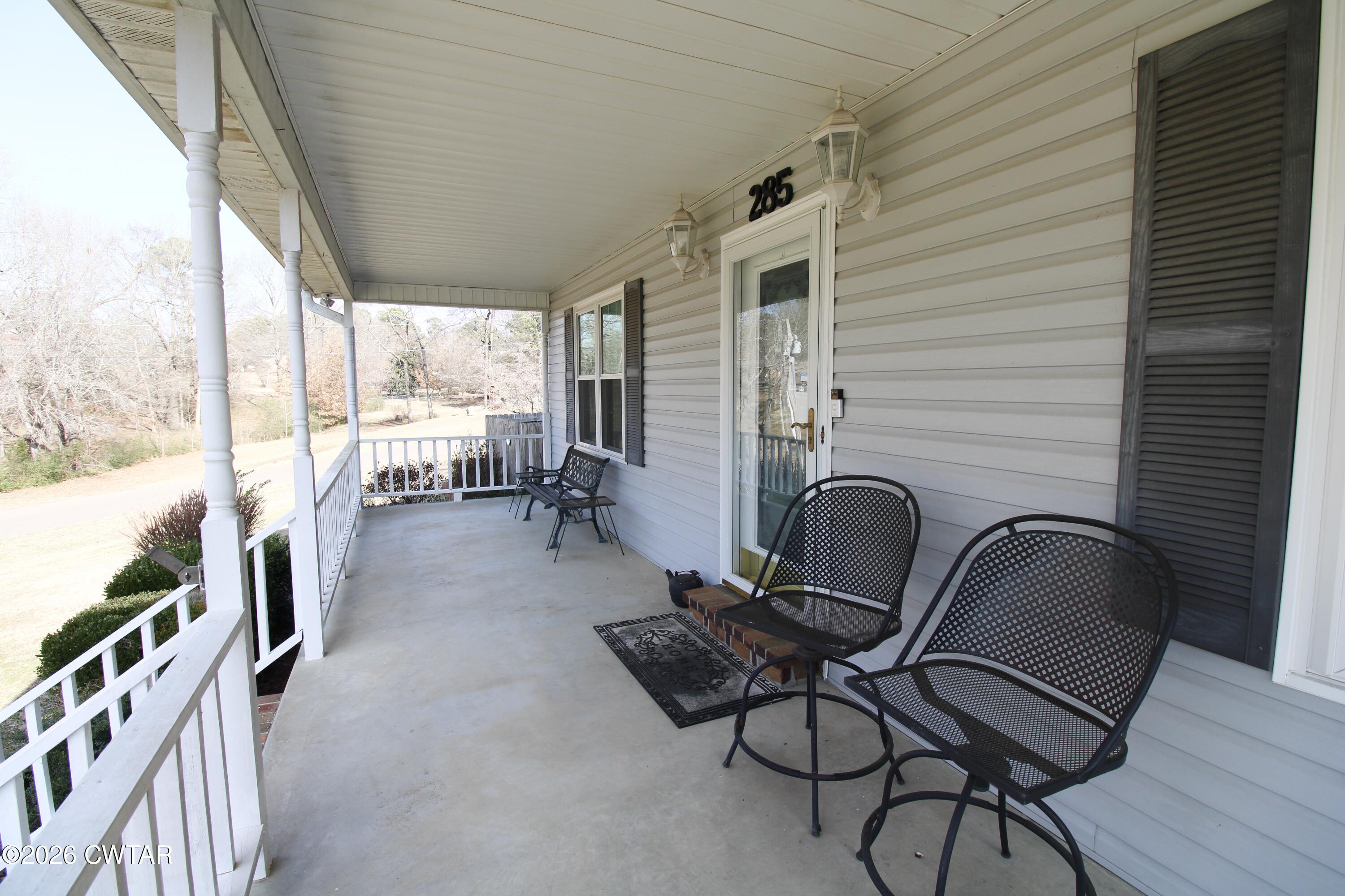 285 Meadowbrook Circle Lexington, TN 38351 - Photo 24 of 26 a room with patio furniture and a floor to ceiling window
