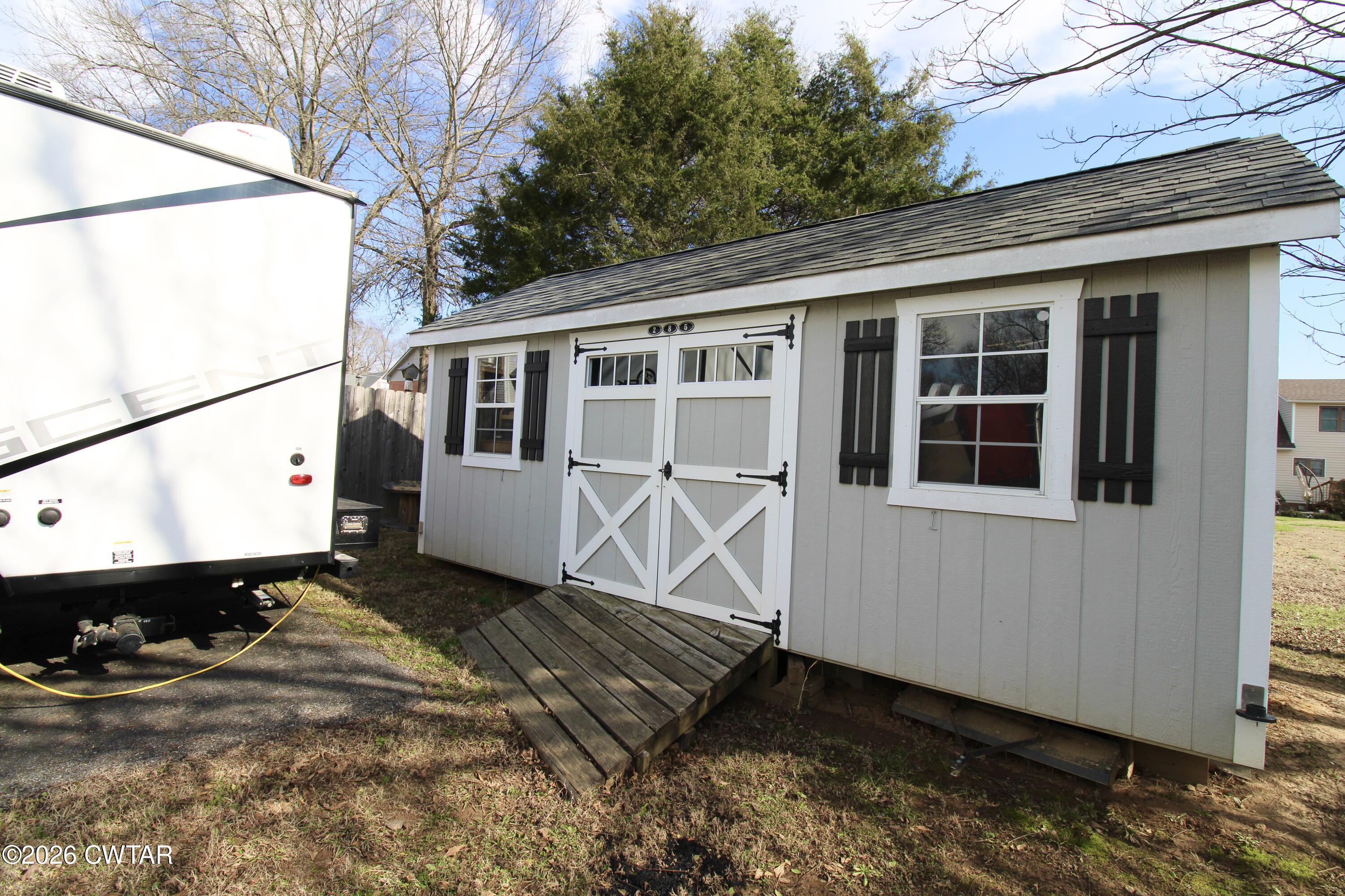 285 Meadowbrook Circle Lexington, TN 38351 - Photo 25 of 26 a house with trees in the background