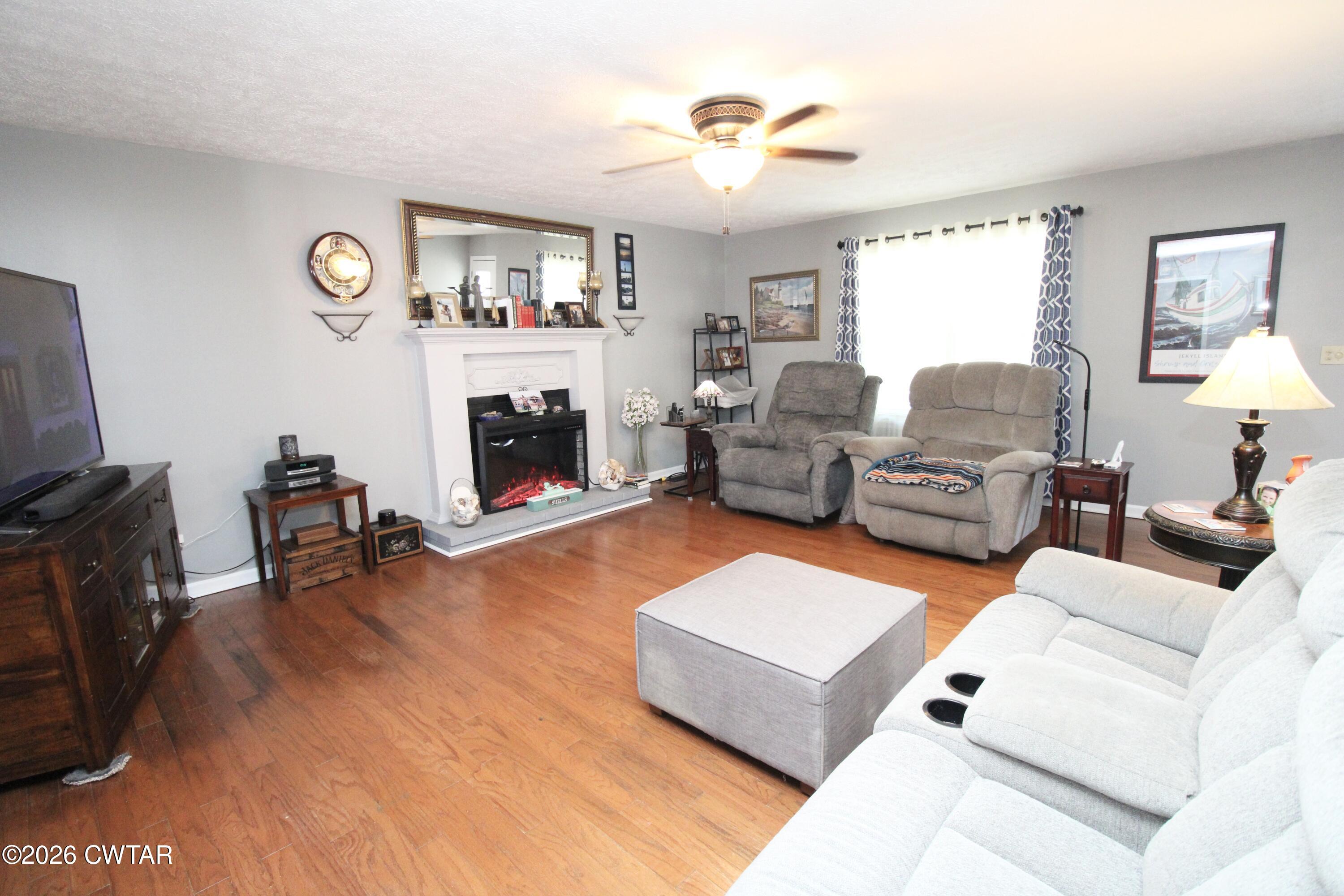 285 Meadowbrook Circle Lexington, TN 38351 - Photo 6 of 26 a living room with furniture and a fireplace