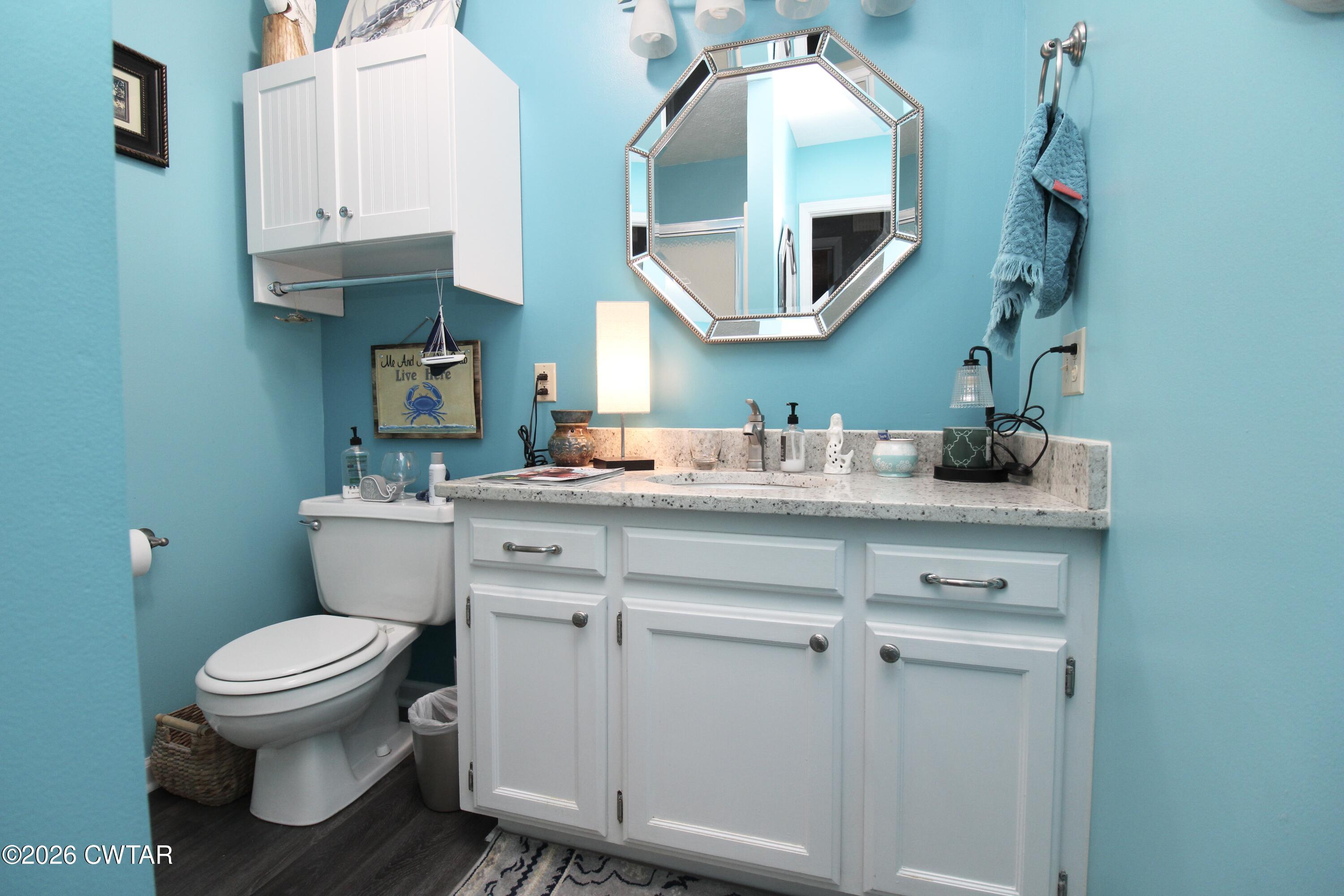 285 Meadowbrook Circle Lexington, TN 38351 - Photo 8 of 26 a bathroom with a toilet sink and mirror