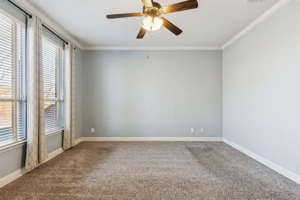 a view of a hallway with windows and entryway