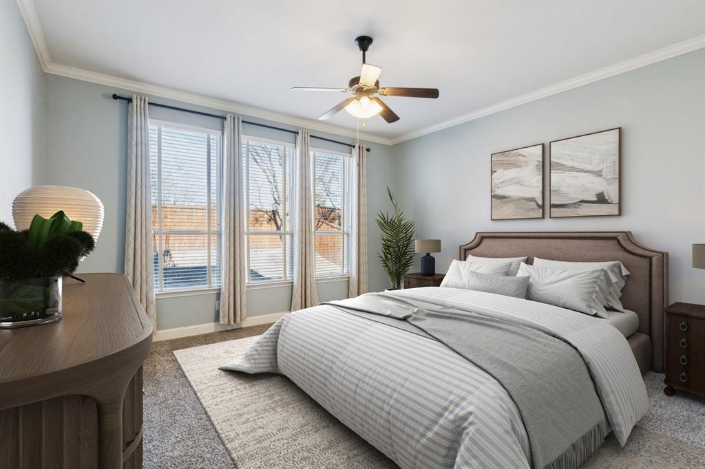 10234 Cava Road Frisco, TX 75035 - Photo 15 of 40 a bedroom with a large bed and a chandelier