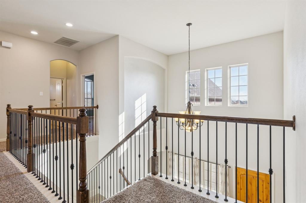 10234 Cava Road Frisco, TX 75035 - Photo 23 of 40 a view of a hallway with windows and entryway