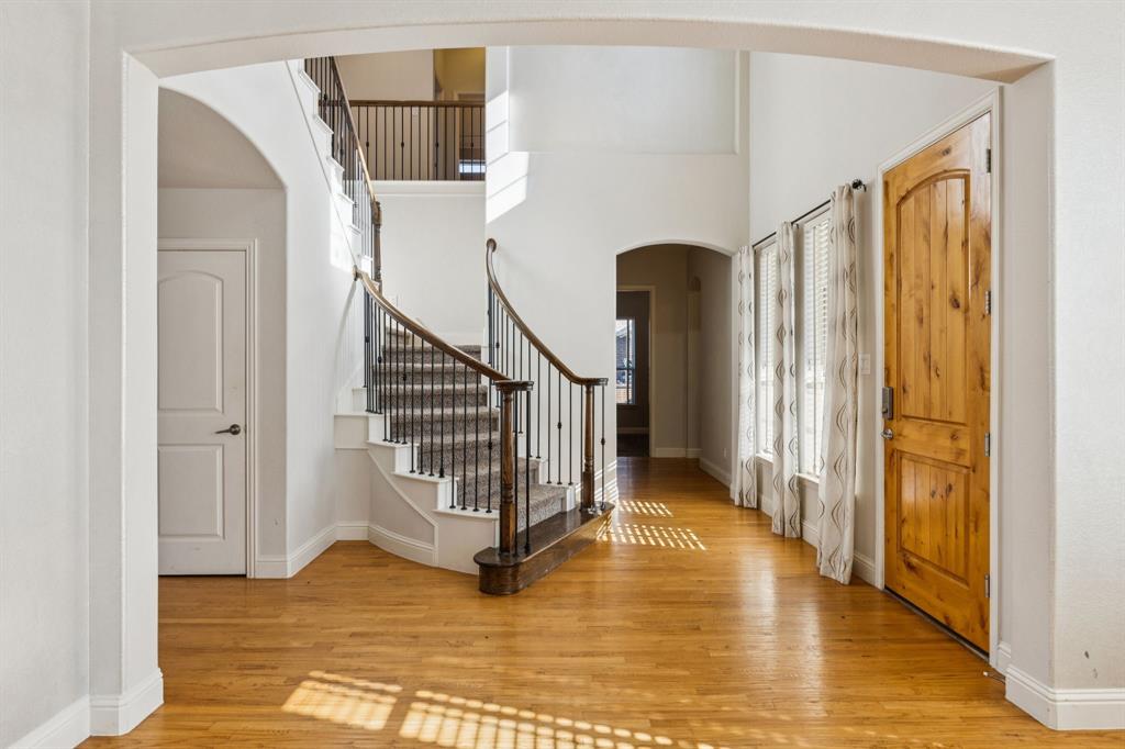 10234 Cava Road Frisco, TX 75035 - Photo 3 of 40 a view of entryway and hall with wooden floor