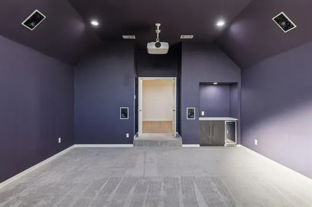 a view of an empty room with a chandelier