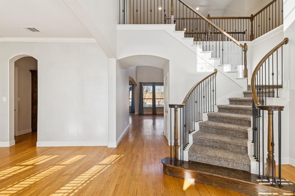 10234 Cava Road Frisco, TX 75035 - Photo 5 of 40 a view of entryway and hall with wooden floor