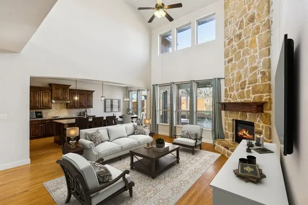 a view of an empty room with window and fire place