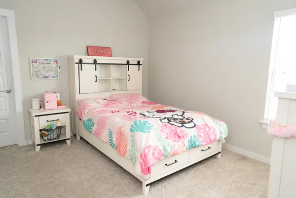 a bathroom with a sink a toilet a mirror and shower