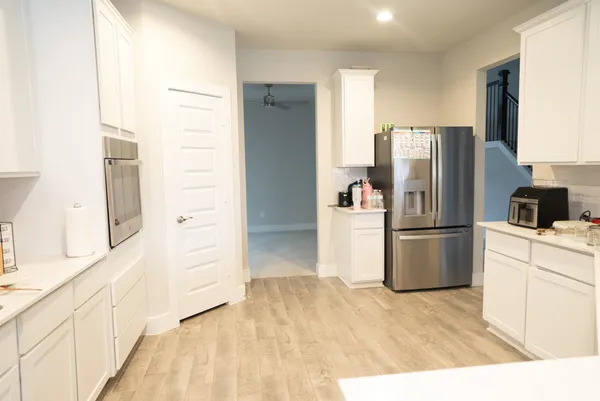 a kitchen with a stove and a microwave