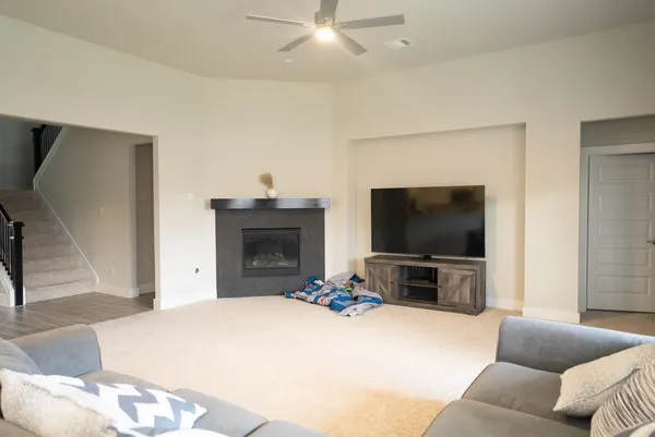 a living room with furniture and a large window