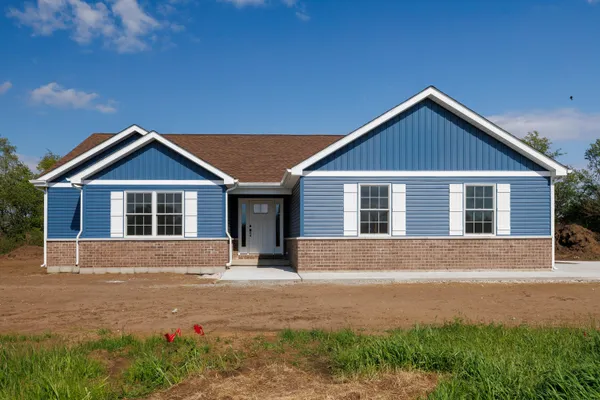 a front view of a house with yard