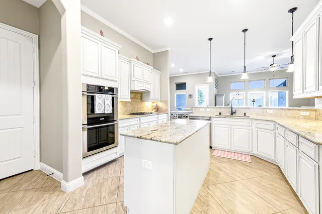 a living room with fireplace furniture and a wooden floor