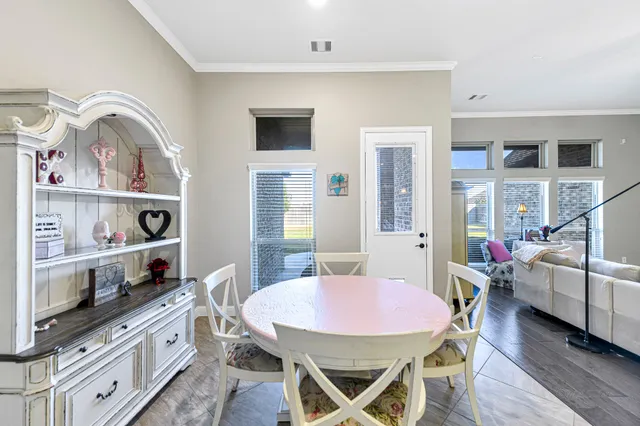 a en suite bathroom with a granite countertop sink and a mirror