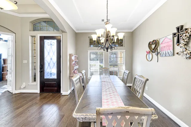 a large white kitchen with a large window