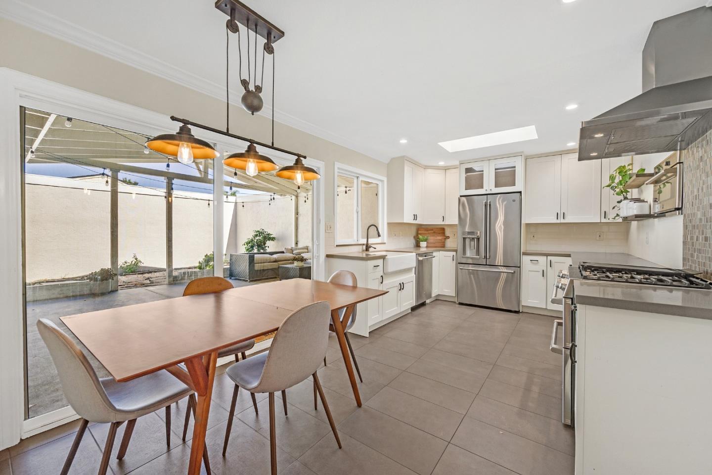 2514 Heatherlark Circle Pleasanton, CA 94566 - Photo 11 of 40 a dining room with stainless steel appliances a table and chairs