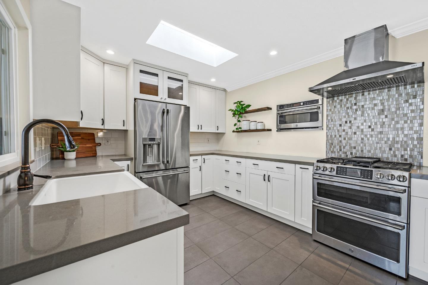 2514 Heatherlark Circle Pleasanton, CA 94566 - Photo 12 of 40 a kitchen with granite countertop a refrigerator stove and sink