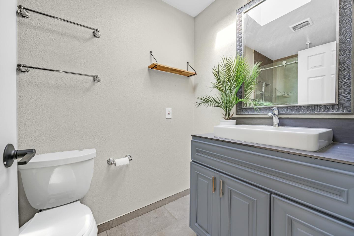 2514 Heatherlark Circle Pleasanton, CA 94566 - Photo 18 of 40 a bathroom with a sink a mirror and a toilet