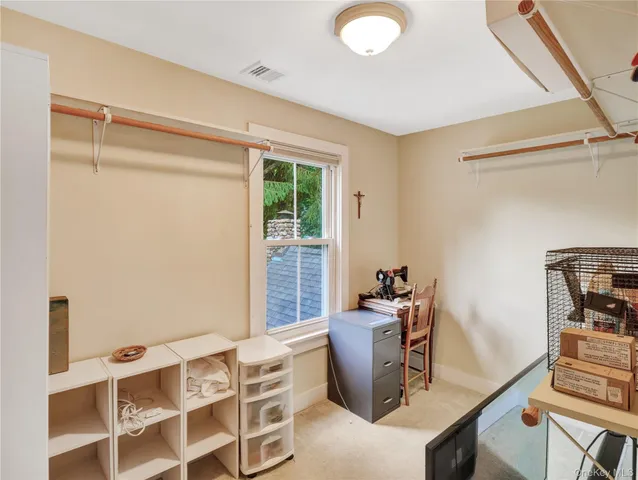 a dining room with furniture and front door