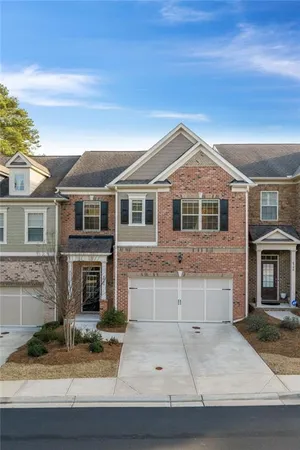 a front view of a house with garage