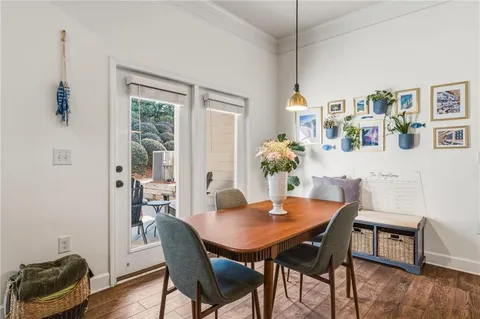 a kitchen with granite countertop a sink and a wooden floors