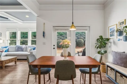 a hallway with front door wooden floor and entryway