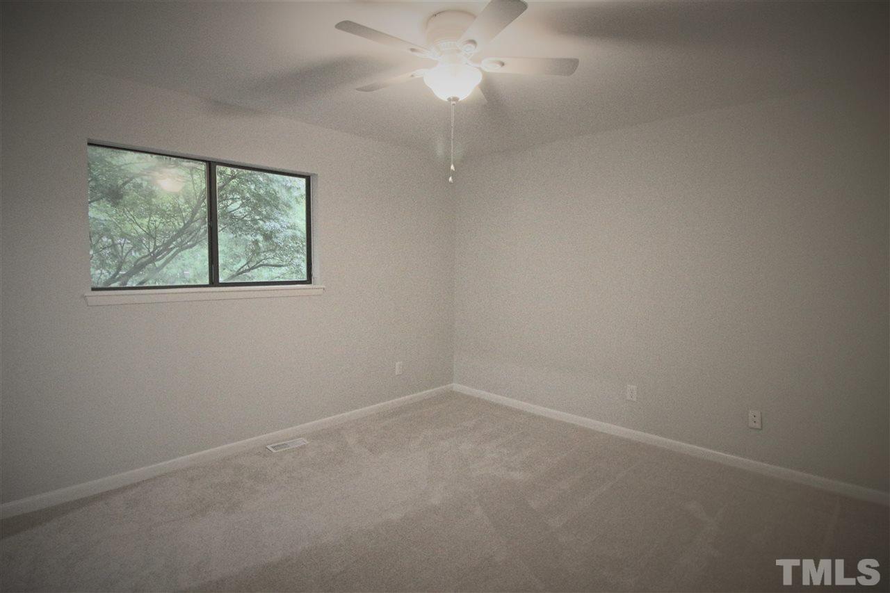 5815 Shady Grove Circle Raleigh, NC 27609 - Photo 11 of 19 an empty room with a window