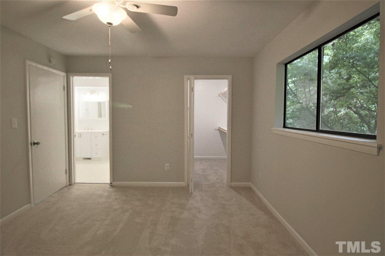 5815 Shady Grove Circle Raleigh, NC 27609 - Photo 12 of 19 an empty room with windows and closet