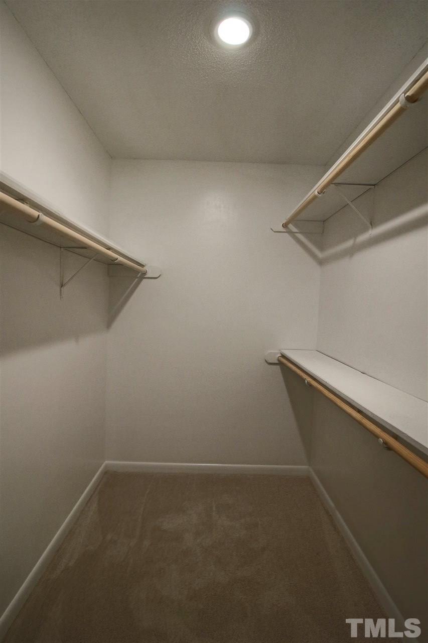 5815 Shady Grove Circle Raleigh, NC 27609 - Photo 13 of 19 a view of a room with racks on the wall