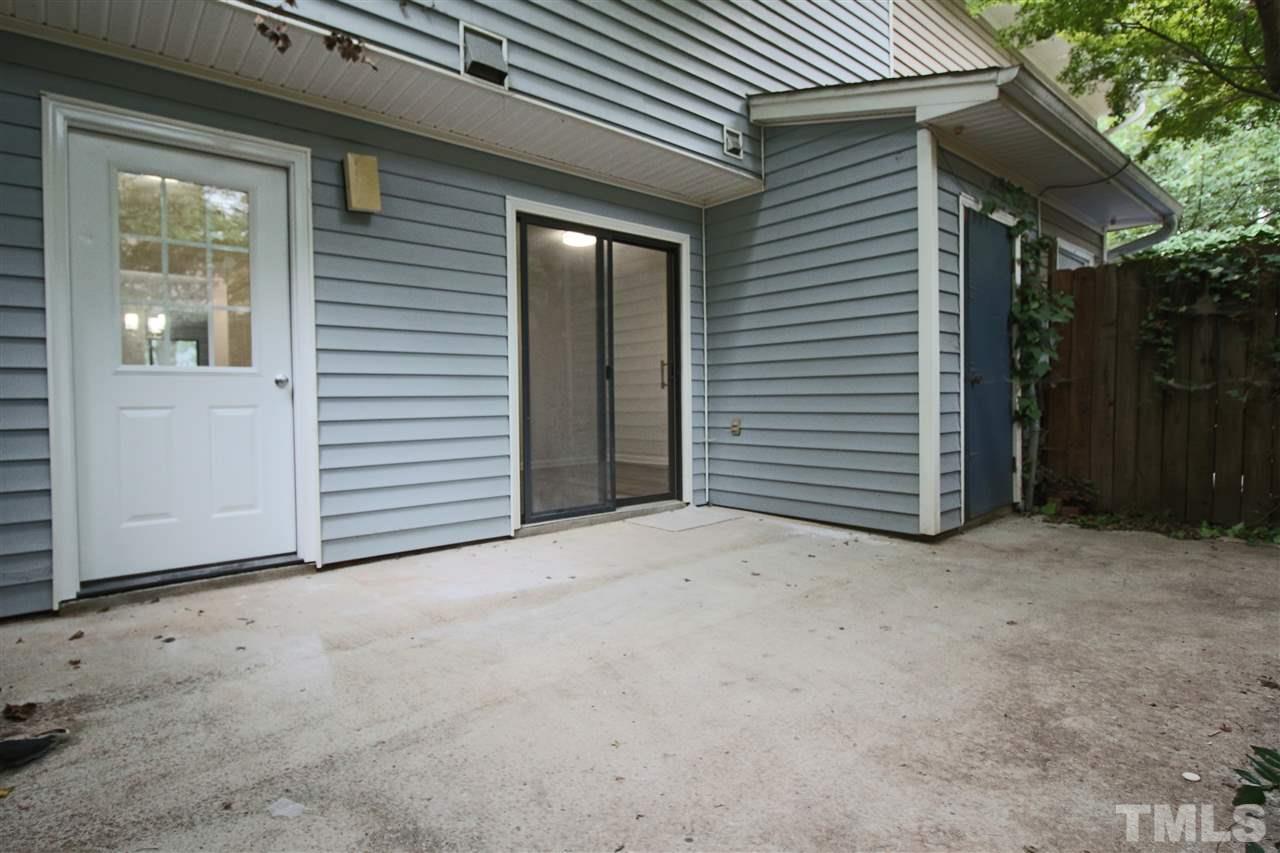 5815 Shady Grove Circle Raleigh, NC 27609 - Photo 17 of 19 a view of an empty room with yard and tree