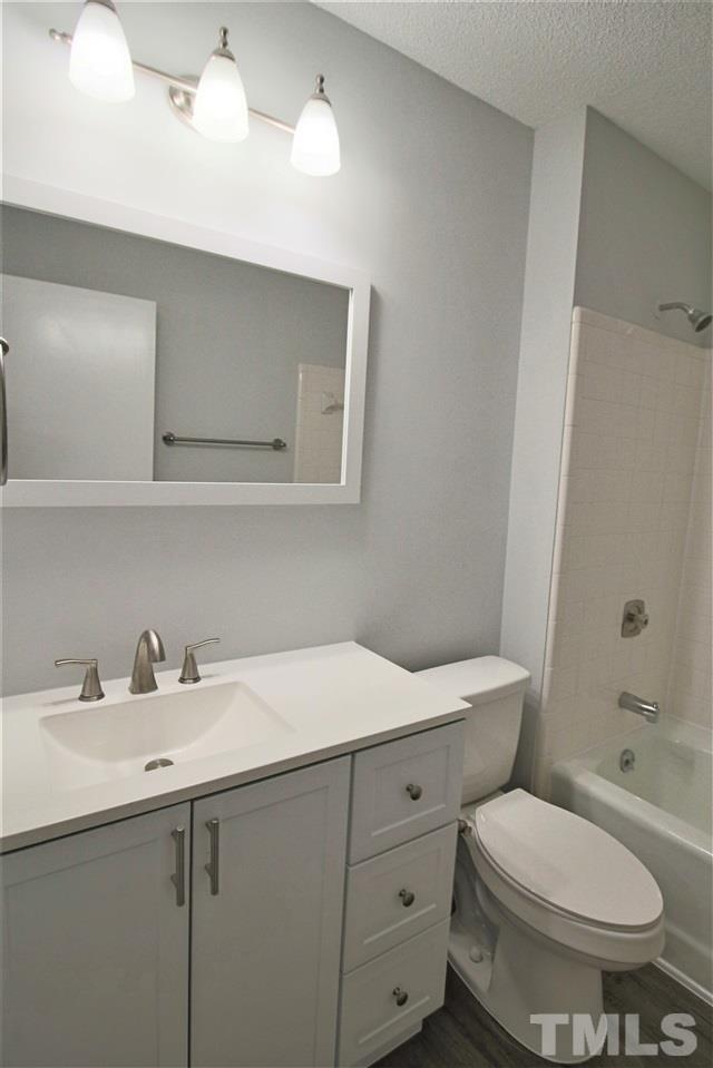 5815 Shady Grove Circle Raleigh, NC 27609 - Photo 9 of 19 a bathroom with a sink a toilet and shower
