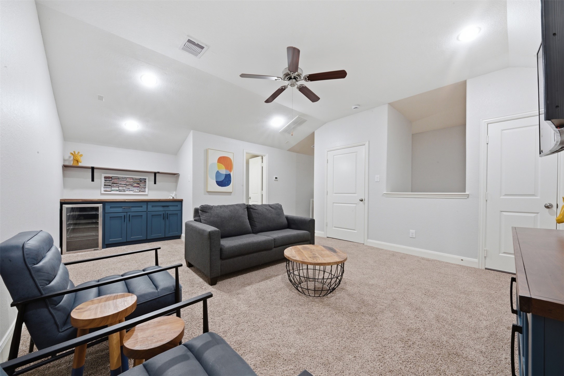 706 Water Street Webster, TX 77598 - Photo 18 of 23 A spacious game room with dry bar, ideal for movie nights, hosting, or a creative retreat. With its own powder bath, this space easily transforms into a fourth bedroom or private suite.