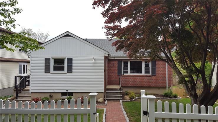 10 Pemberwick Road Greenwich, CT 06831 - Photo 1 of 1 a front view of house with yard