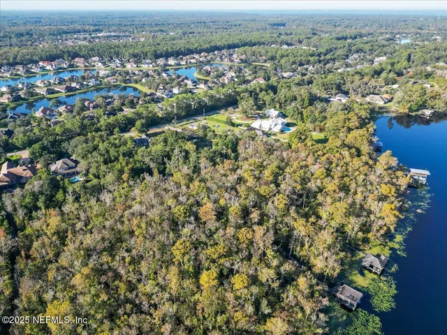 an aerial view of residential house with yard and outdoor space