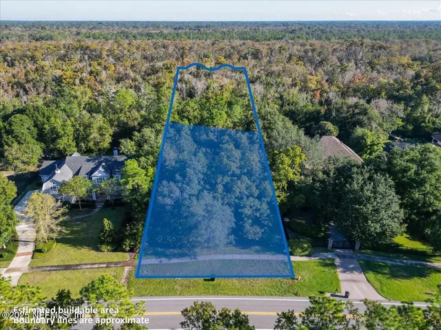 an aerial view of a house with a garden