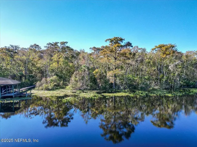a view of lake with green space