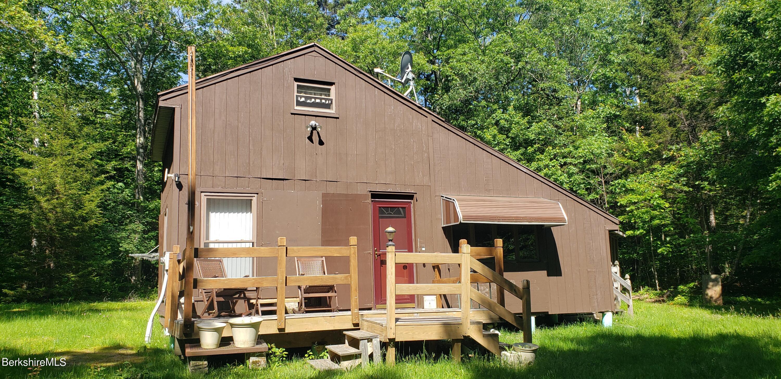 110 Strykers Road Florida, MA 01247 - Photo 1 of 20 a view of a house with backyard